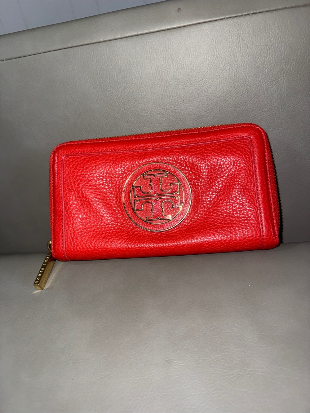 Tory Burch orange Pebbled Leather Zip Wallet with Gold Logo